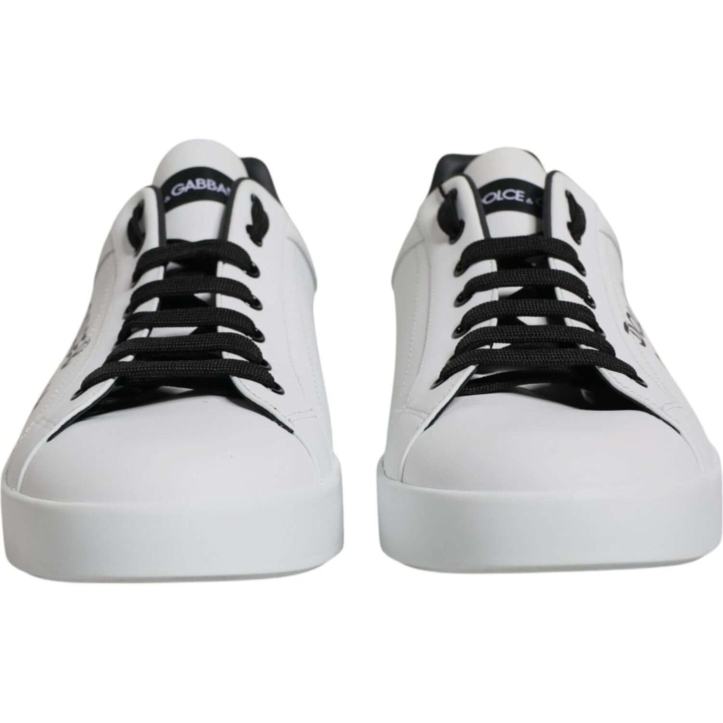 Dolce & Gabbana Portofino white leather sneakers with logo, featuring lace-up closure and rubber sole, lightly preowned with minor wear.