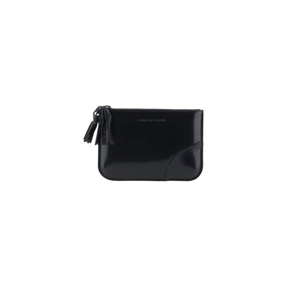 Comme Des Garçons leather coin purse with brand logo, shiny finish, and zipper closure. Perfect stylish accessory.