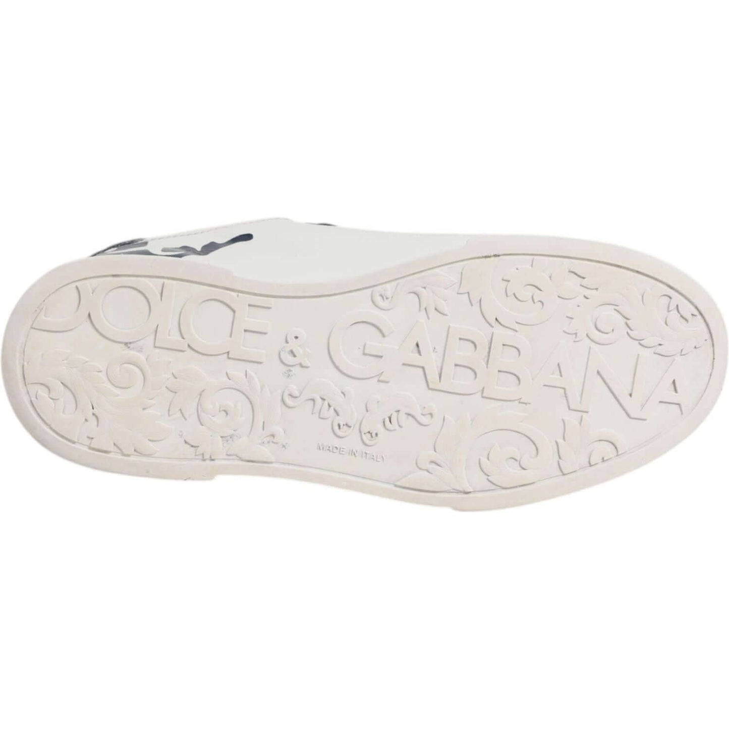Sole view of Dolce & Gabbana white and blue leather crown Milano sneakers with embossed logo details.
