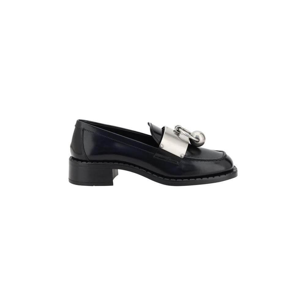 Prada black leather loafers for women with block heel, squared toe, and silver logo plaque, featuring elegant design and luxurious details.
