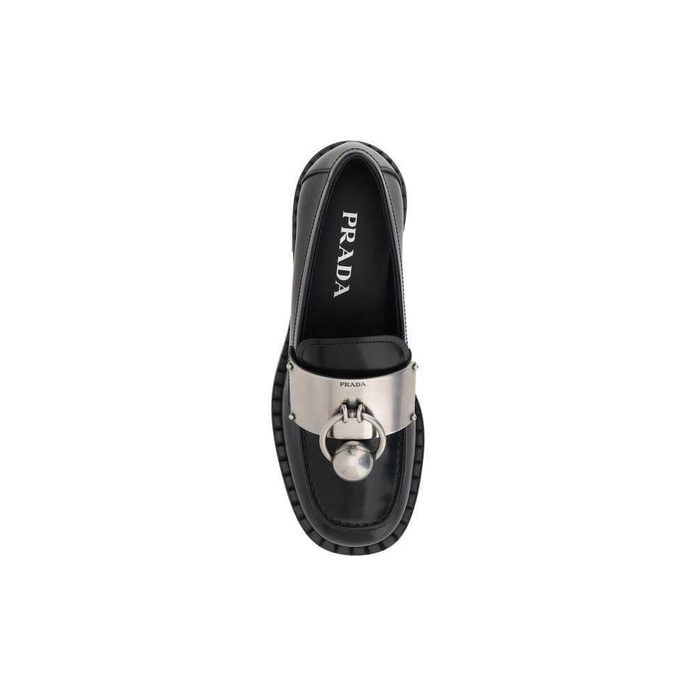 Top view of Prada leather women's loafer with a block heel, squared toe, and logo-embossed metal plaque for a refined, sophisticated look.