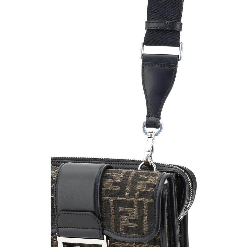 Fendi Double Baguette Shoulder Bag with adjusted strap and iconic FF logo, featuring metal plaque and zippered pocket detail.