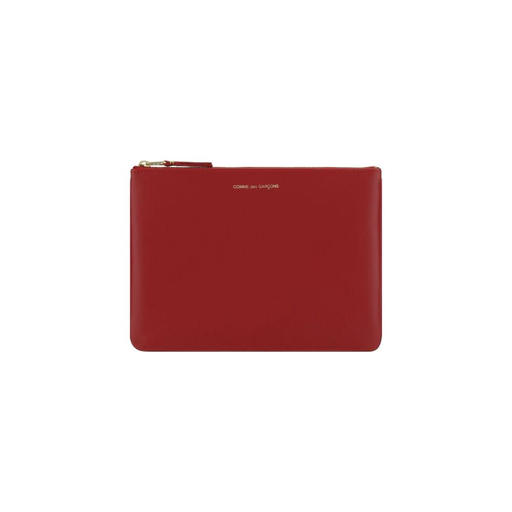 Comme Des Garçons Classic Leather Line red zip pouch, minimalist design, premium leather accessory, sophisticated and stylish.