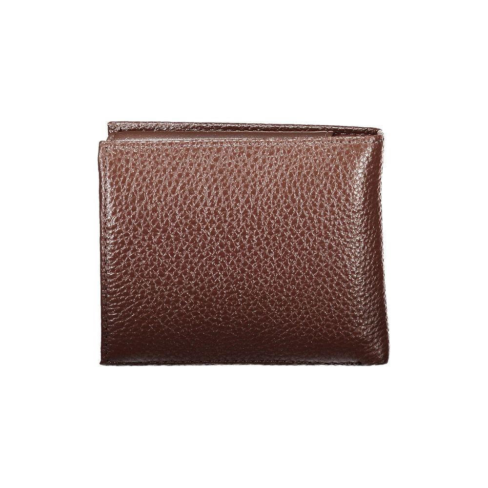 Tommy Hilfiger elegant brown leather bifold wallet with coin purse and card slots. Stylish design with contrasting details.