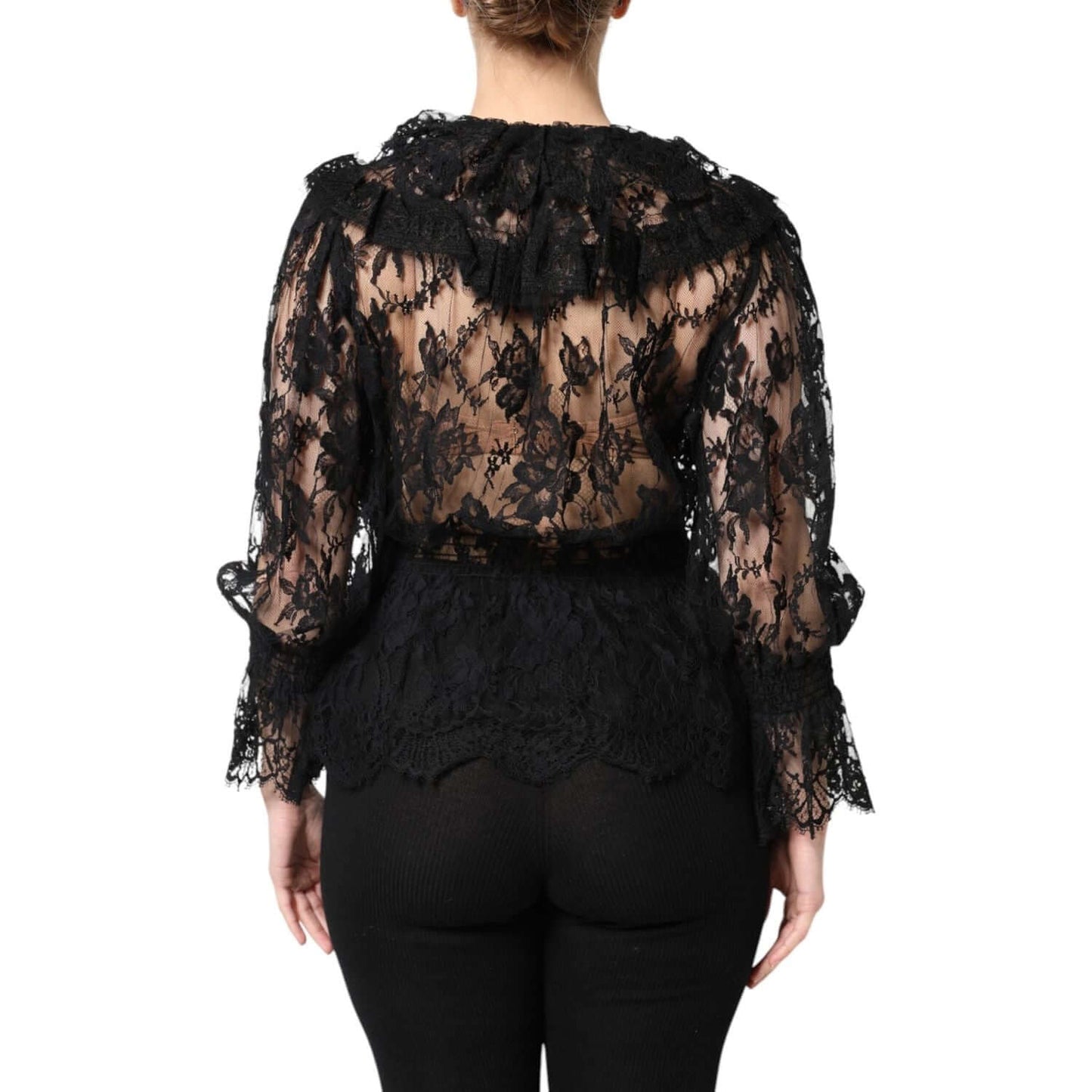 Woman wearing Dolce & Gabbana black floral lace cotton blouse, long sleeves, rear view, showcasing luxury Italian fashion