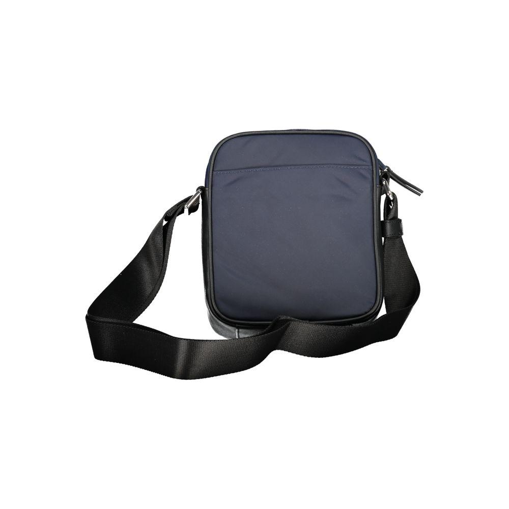 Tommy Hilfiger blue shoulder bag with adjustable strap, featuring a zip closure, one external and one internal pocket, logo on recycled polyester.