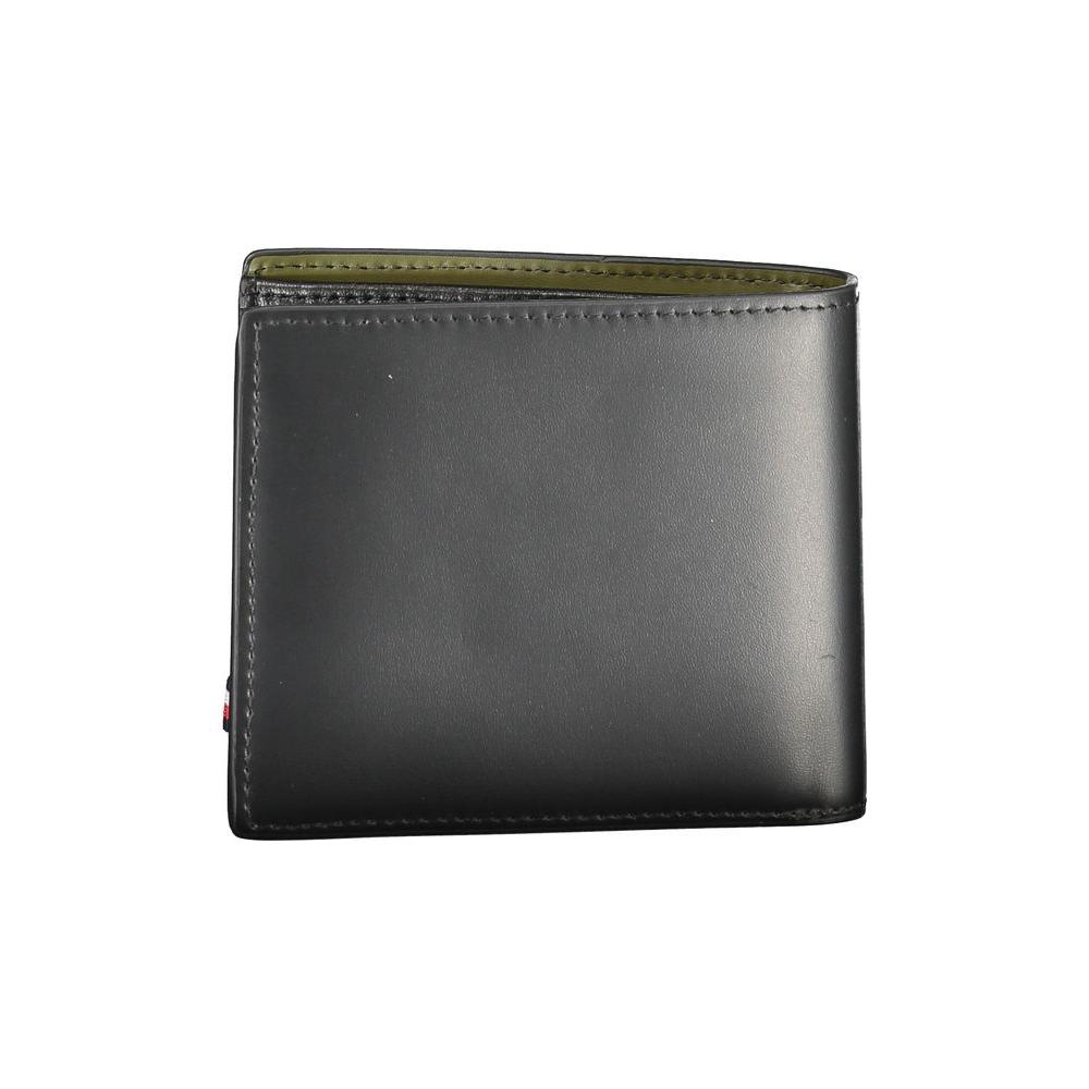 Tommy Hilfiger black leather wallet with two compartments, coin purse, card slots, contrasting details, and logo print.
