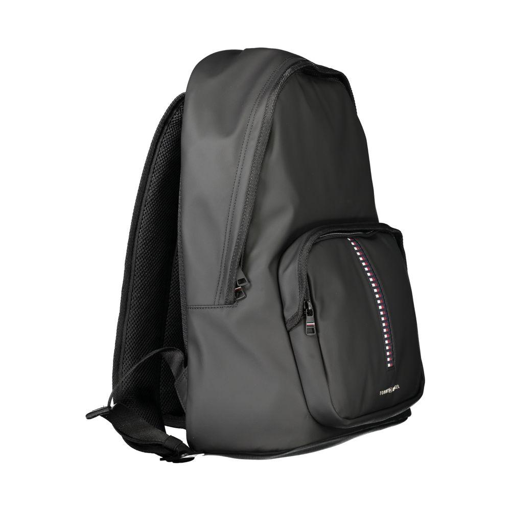 Tommy Hilfiger black polyethylene men's backpack with sleek design, adjustable straps, and laptop compartment, featuring a logo detail.
