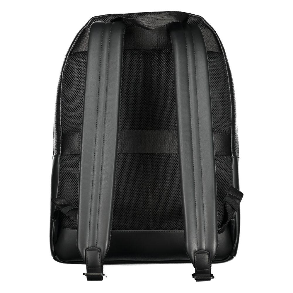 Back view of Tommy Hilfiger black polyester backpack with adjustable shoulder straps and mesh padding for comfort.