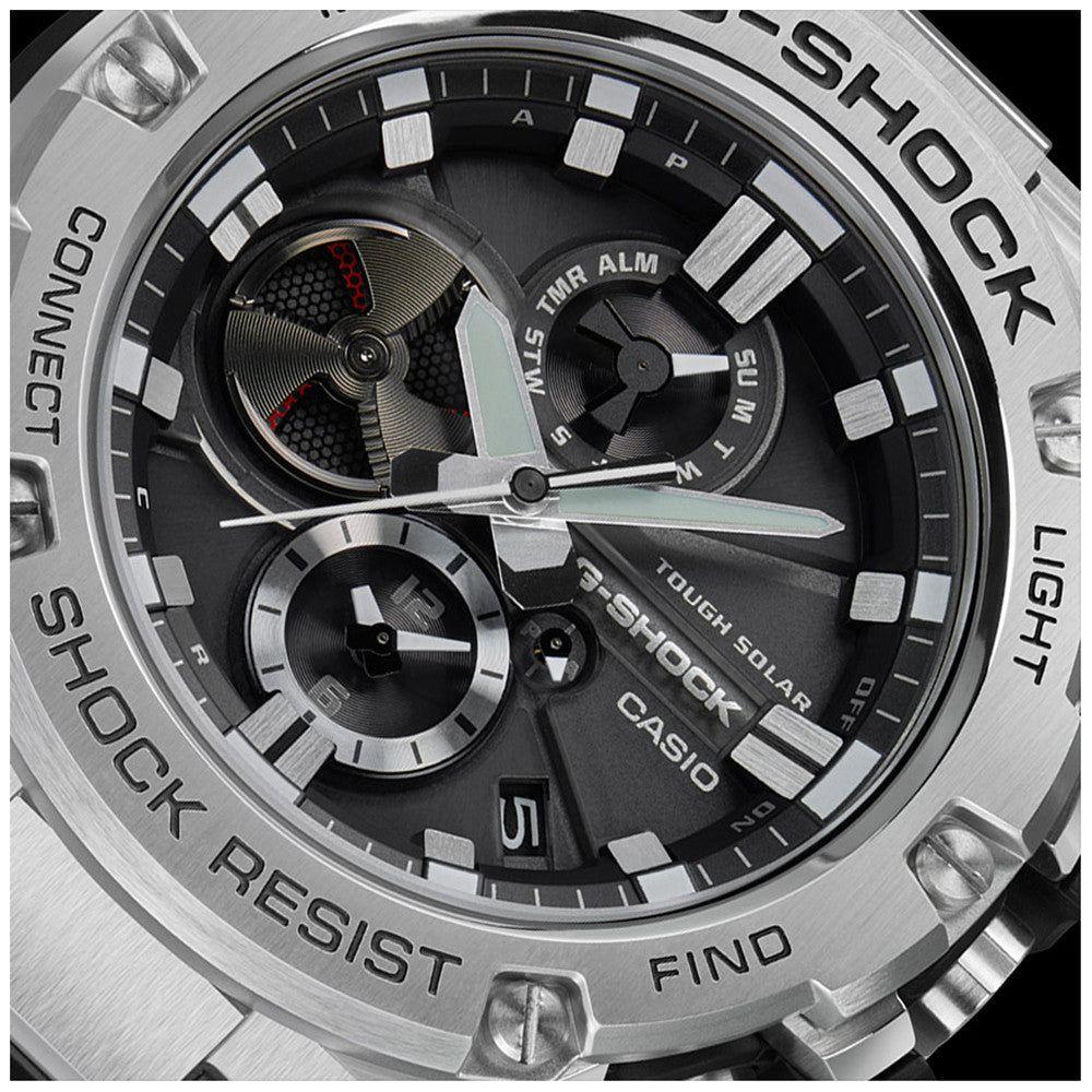 Close-up of CASIO G-SHOCK MASTER OF G G-STEEL Bluetooth watch with solar movement, stainless steel bezel, and multifunction display.