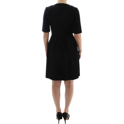CO|TE Black short sleeve venus dress