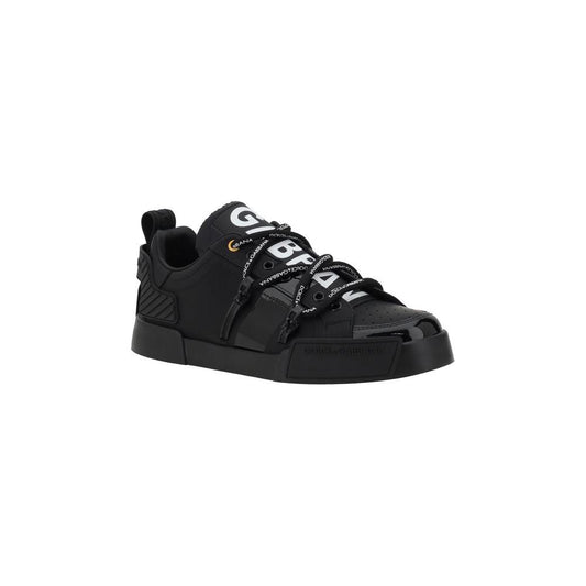 Black Dolce & Gabbana Portofino sneakers with patent leather, woven elasticated laces, and a logoed flat sole for comfort and style.