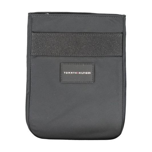 Tommy Hilfiger black shoulder bag with logo, adjustable strap, recycled polyester, external and internal pockets, zip closure.