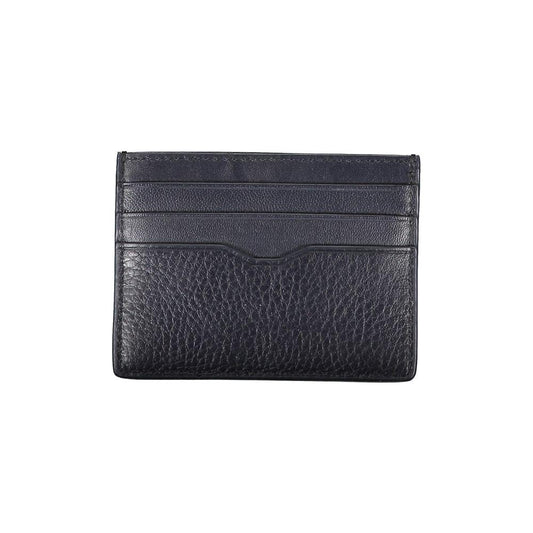 Tommy Hilfiger sleek blue leather card holder with contrast details and logo, featuring a central pocket for everyday essentials.